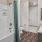 a bathroom with a tub sink and toilet