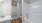 Bathroom with walk-in closet, sink,  toilet, and tub/shower combo,