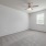 Spacious bedroom with carpet