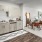 a kitchen with a dining table and a refrigerator