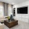 a living room with a tv and couches