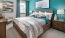 a bedroom with a bed and a desk