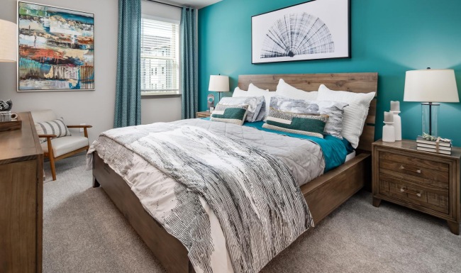 a bedroom with a bed and a desk