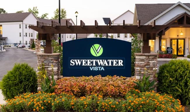 a sign in front of a building